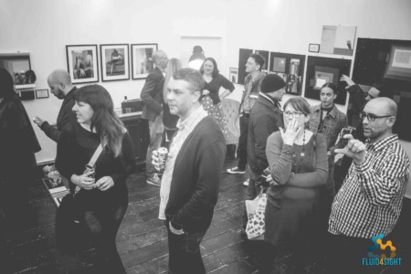 Room filled with people at the gallery